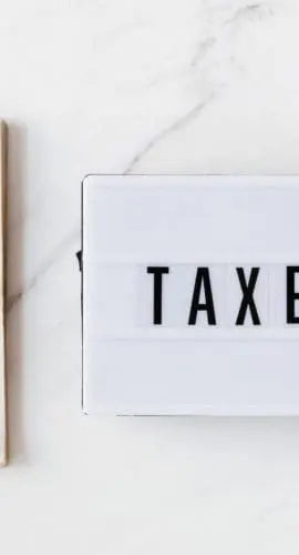 American dollar bills and vintage light box with inscription