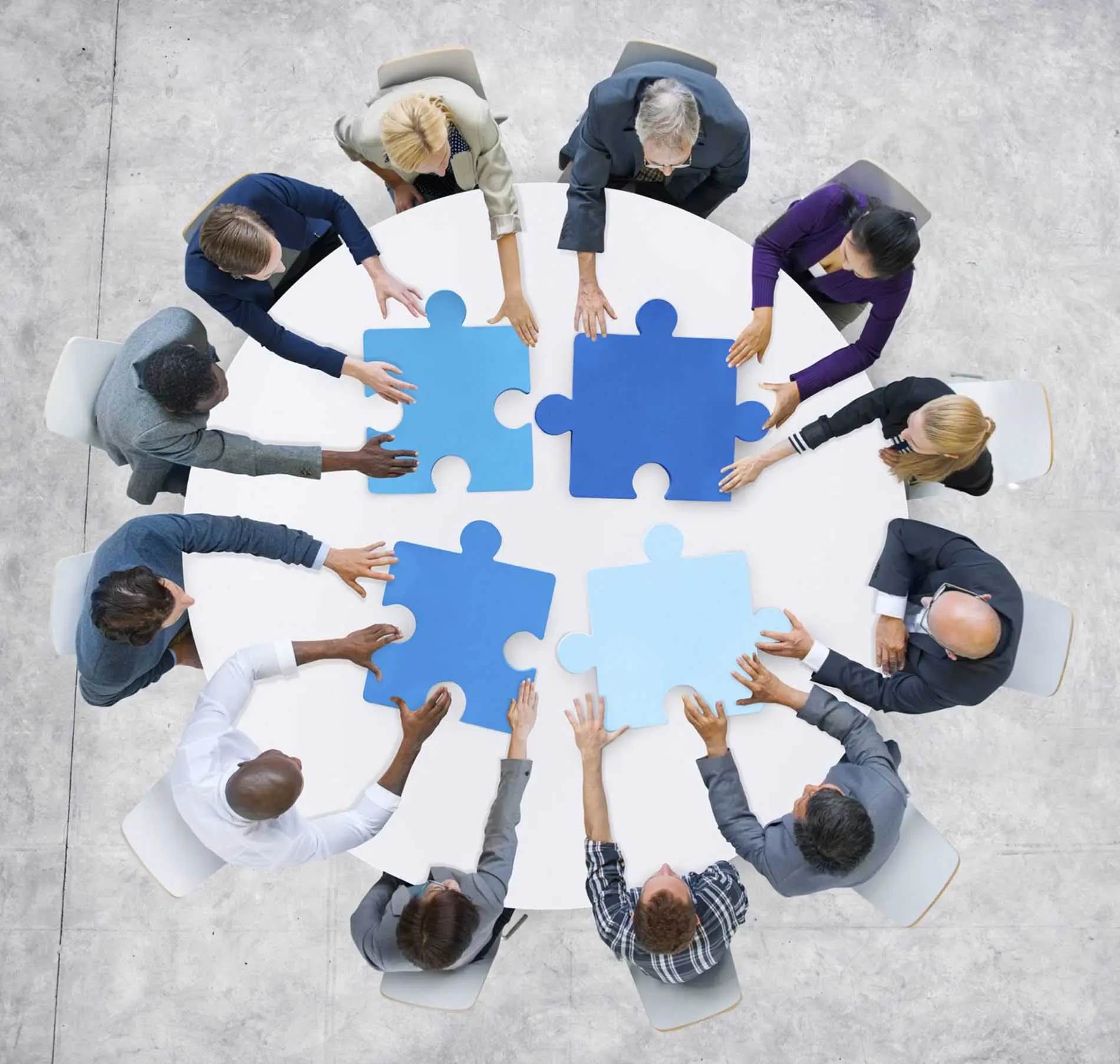Business People And Jigsaw Puzzle Pieces