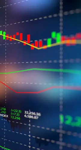 A colorful financial graph displays a variety of fluctuating stock market trends and data on a screen.