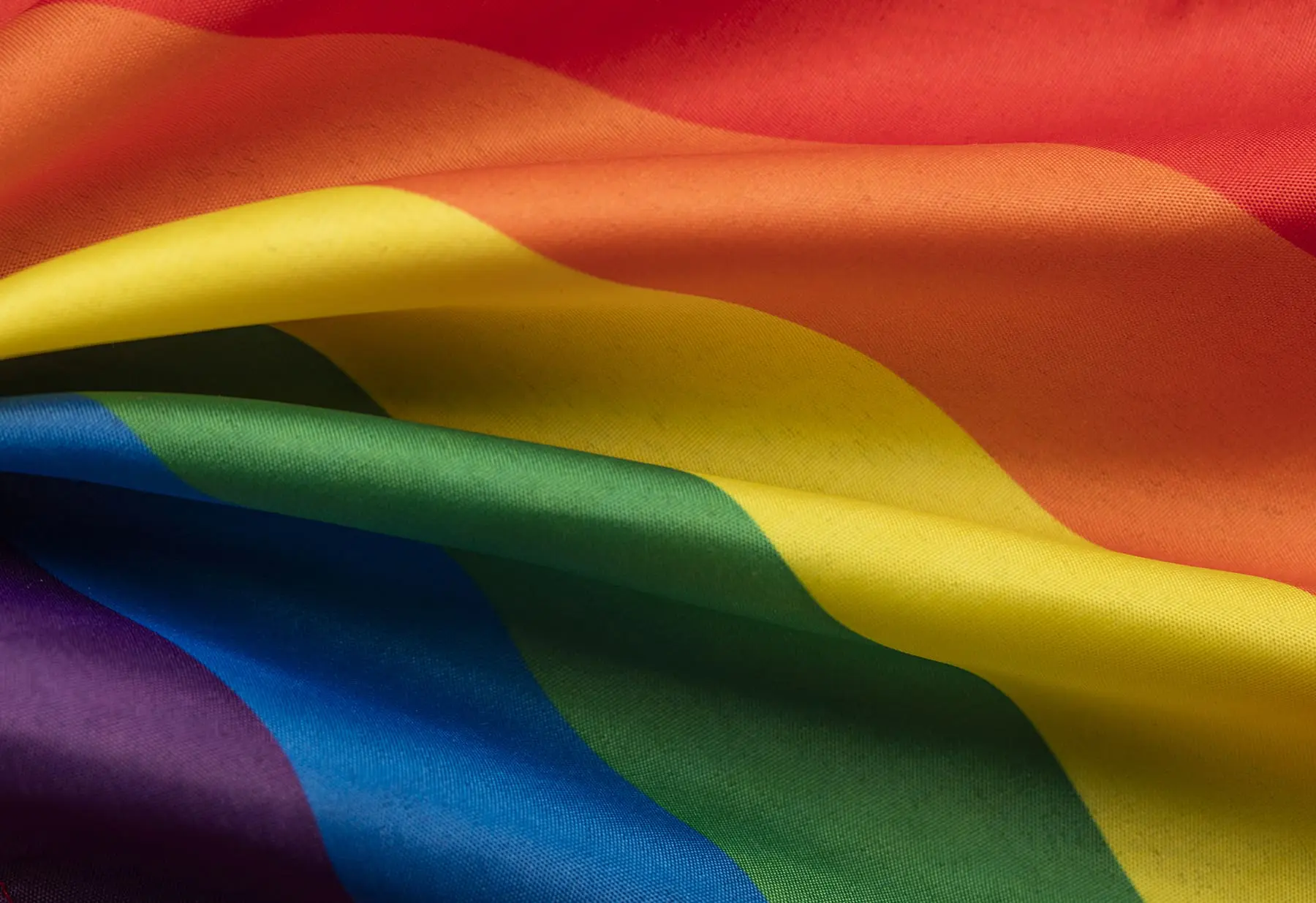 A close-up view of the rainbow flag, often associated with LGBTQ+ pride.