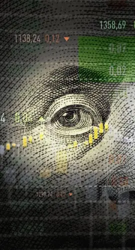 A financial market graph is overlaid on a close-up of Benjamin Franklin's face from the U.S. $100 bill.