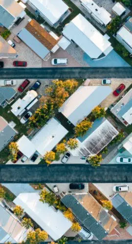 Houses and vehicles near horizontal roads in suburb