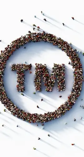 Human crowd forming trademark symbol on white background. Horizontal composition with copy space.