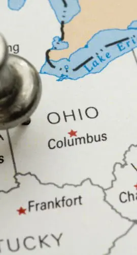 A pushpin is placed on a map marking Columbus, Ohio, with surrounding states and cities labeled.