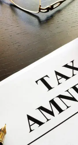 Papers about tax amnesty and gavel in a court.