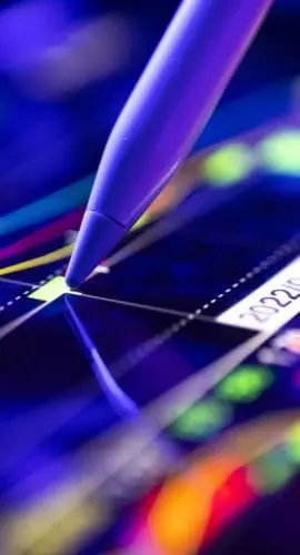 Person analyzing the market trends on a digital screen