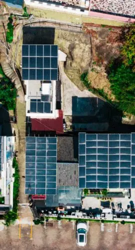 Solar panels on the gable roof of the rustic house