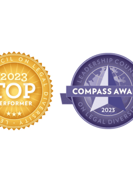 Two award badges from the Leadership Council on Legal Diversity for 2023: a gold Top Performer badge and a blue Compass Award badge.